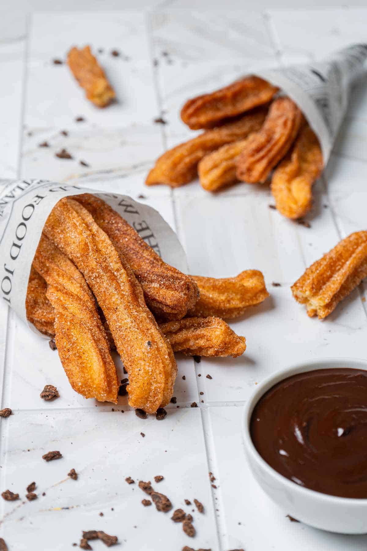 Cinnamon sugar churros served with chocolate dipping sauce.