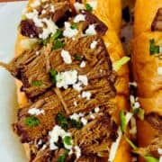 Mexican beef tortas made with shredded beef on bolillo rolls.