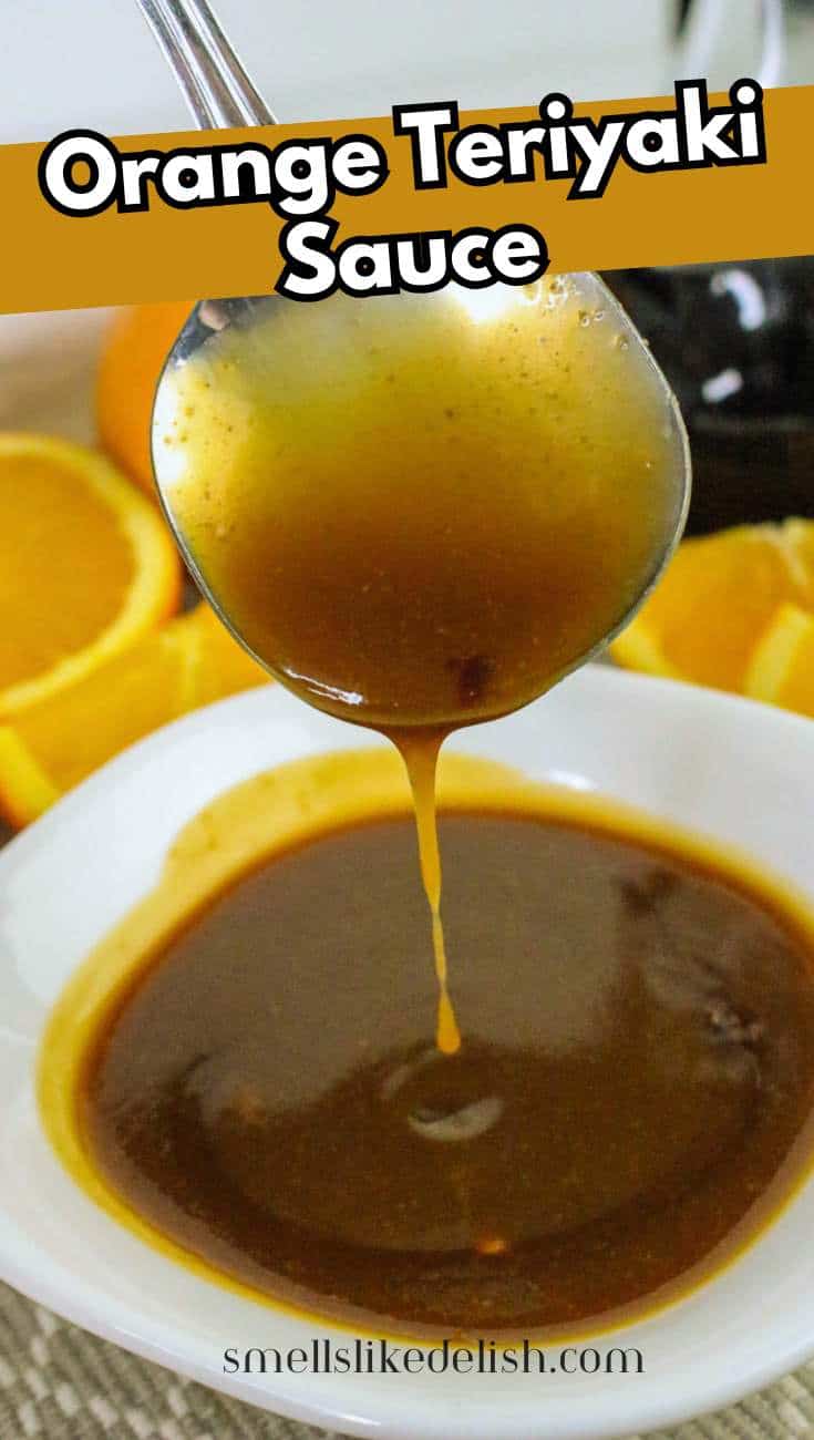 Thick orange teriyaki sauce on a spoon for pin image.