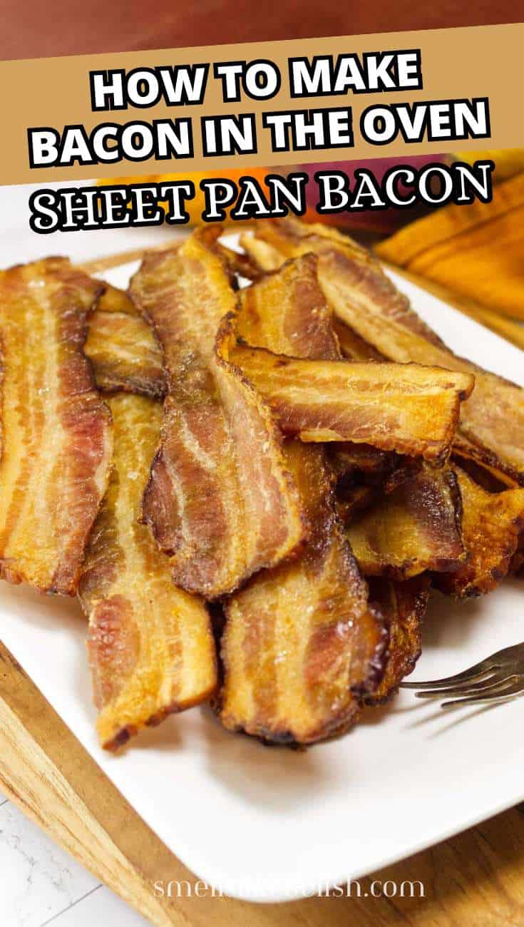 A platter of crispy, cooked bacon strips arranged on a white rectangular plate.
