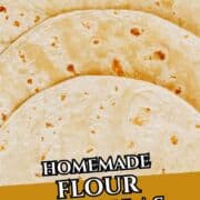 A close-up view of several stacked homemade flour tortillas.