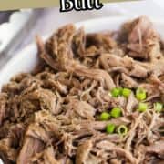 Tender Instant Pot pork butt shredded in a white dish for easy pulled pork meals.