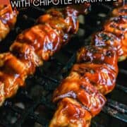 Grilled chicken kabobs with chipotle marinade grill over black grates.