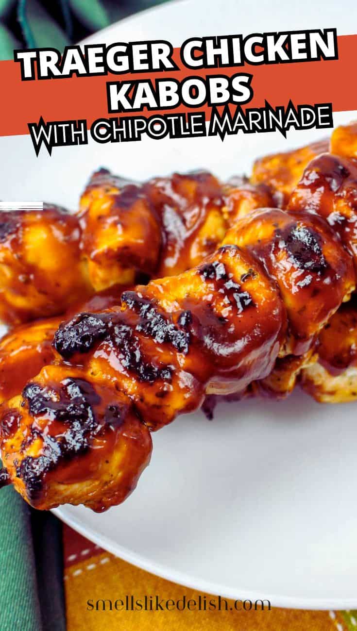 Grilled chicken kabobs with chipotle glaze on skewers, served on a white plate.