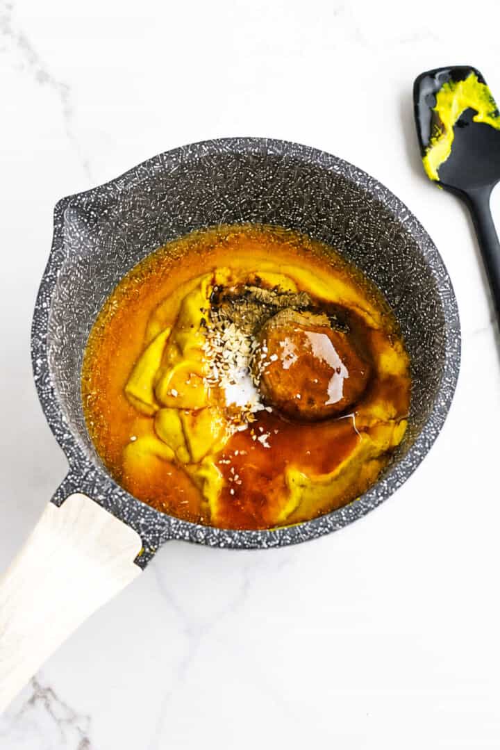 Carolina Gold BBQ sauce ingredients in a black speckled saucepan before simmering.
