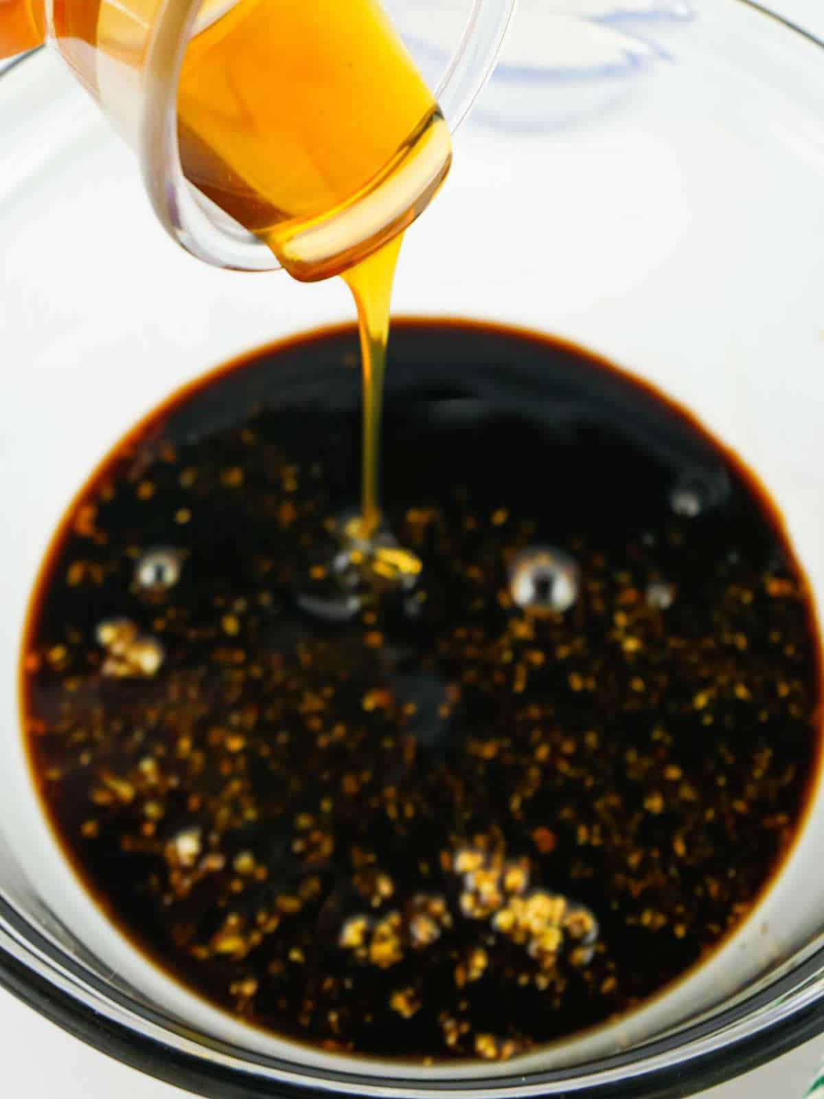 Stir fry marinade for Panda Express String Bean Chicken with soy sauce, hoisin, sesame oil, garlic, ginger, and mirin.