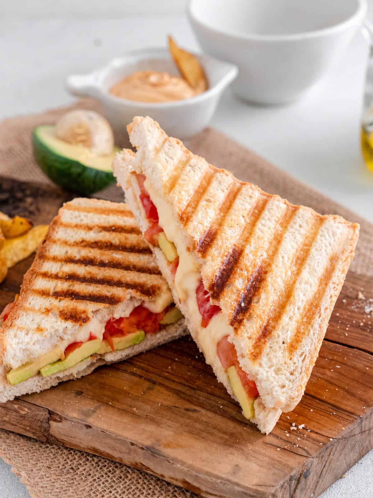 Panera Chipotle Chicken Avocado Melt sandwich with melted Gouda, chicken, avocado, and sweet red peppers on toasted bread.