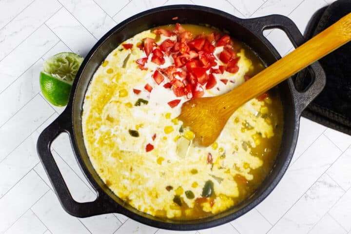 Tomatoes, cream, and lime juice stirred into Panera Summer Corn Chowder.