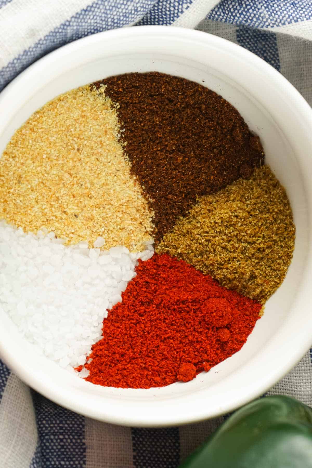 Homemade fajita seasoning spices in a white bowl.