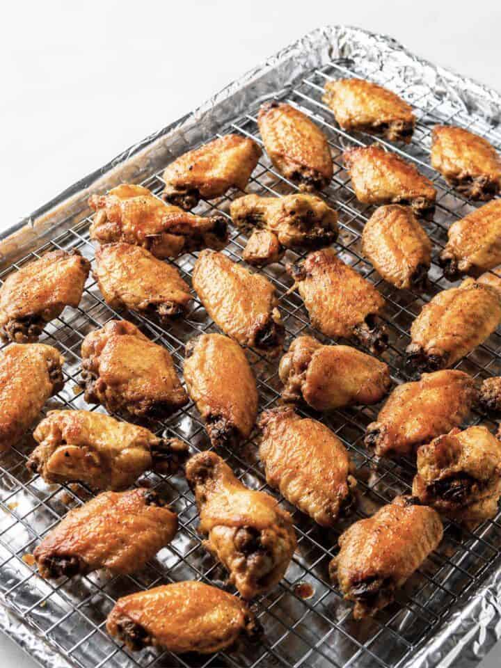 Crisp baked chicken wings on a wire rack before adding soy garlic glaze.
