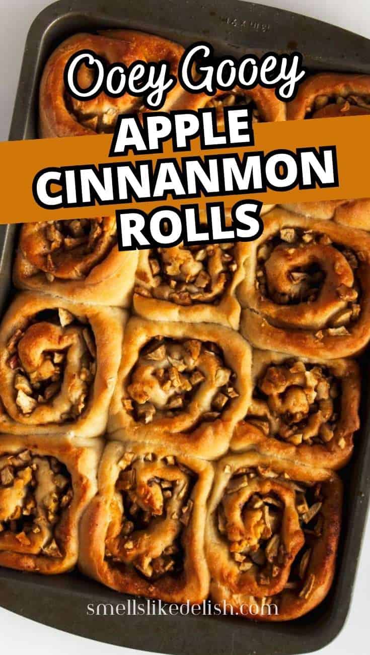 Tray of golden apple cinnamon rolls with chopped apples on top. Text: "Oooey Gooey Apple Cinnamon Rolls." Website "smellslikedelish.com" at bottom.