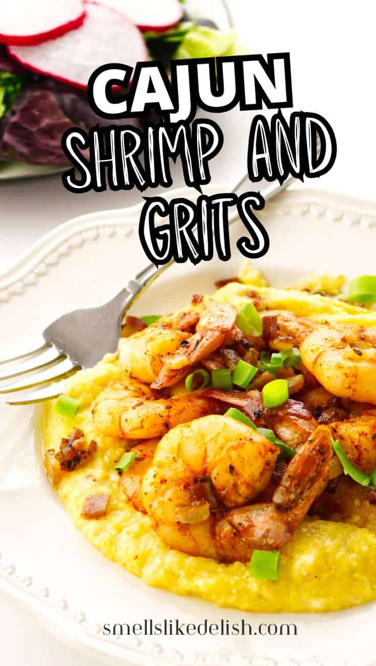 Shrimp and grits with green onions on a white plate, fork beside it; salad with radish slices in the background.