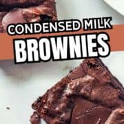 Two chocolate chunk brownies on a white plate, with “Condensed Milk Brownies” written across the image.