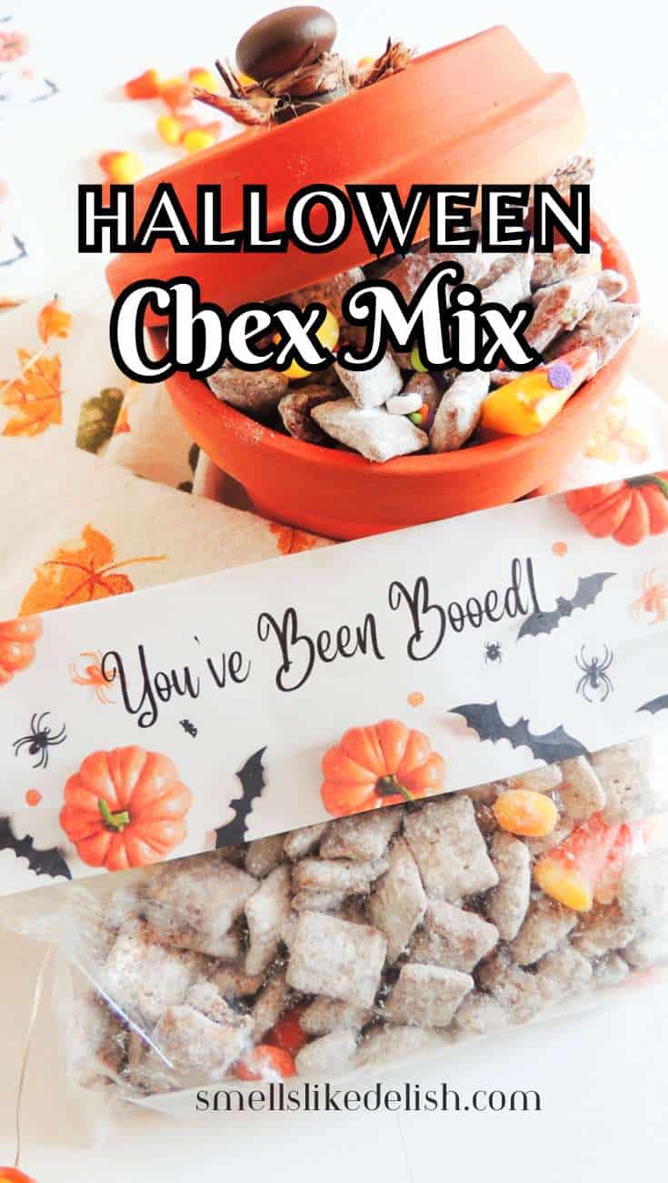 Halloween Chex Mix in a bowl and treat bag with candy corn, chocolate, and festive decorations, plus a "You've Been Booed!" label on a fall tablecloth.