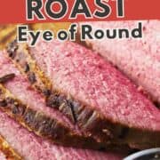 Sliced sous vide eye of round roast beef with pink center, browned edges, and herb butter on the side. Text overlay: "Sous Vide Roast Eye of Round.