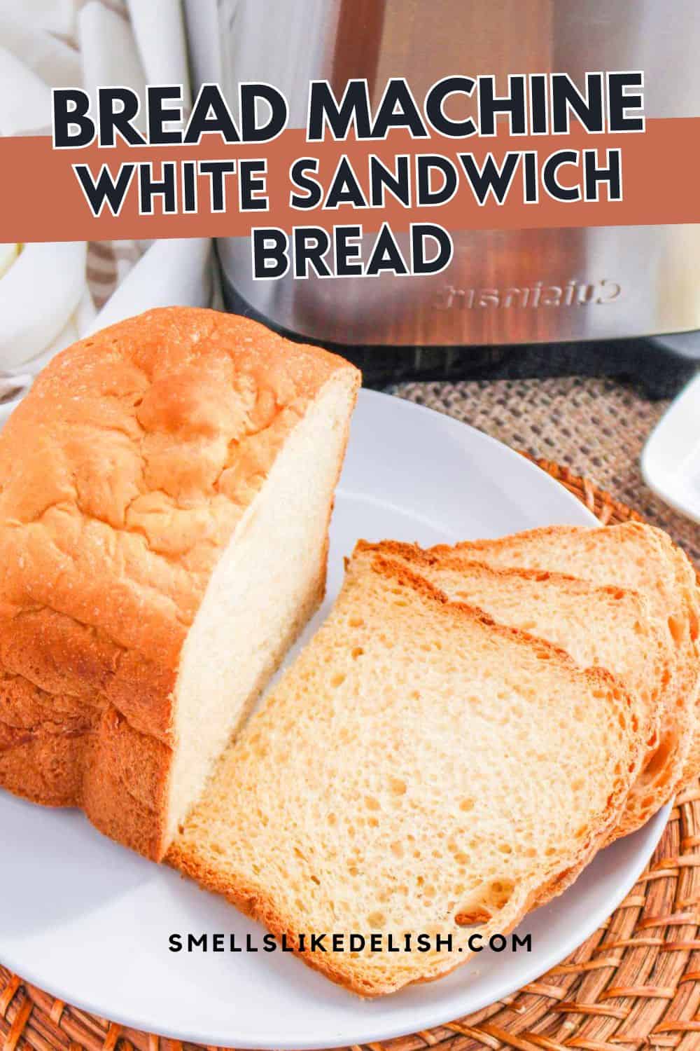 A loaf and two slices of white sandwich bread sit on a plate atop a woven mat, with a bread machine in the background. Text: