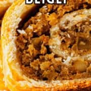 Sliced walnut nut roll with flaky golden crust and walnut filling. Text: “Walnut Nut Rolls Beigli.”.