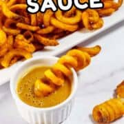 Curly fries on a white plate with Chick-fil-A sauce, one fry dipped. Text says “CHICK-FIL-A SAUCE.” Website “smellslikedelish.com” at the bottom.