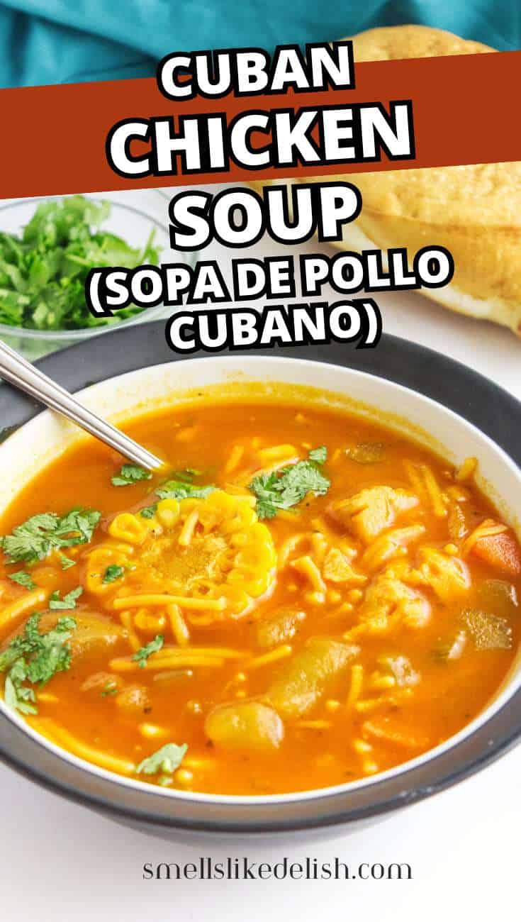 Bowl of Cuban chicken soup with noodles, vegetables, cilantro, and a spoon; herbs and bread in the background. Text: