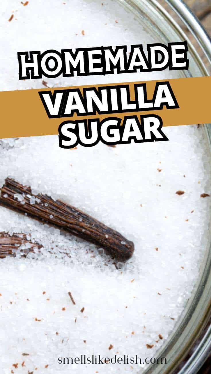 Glass jar containing white sugar and vanilla beans, with