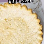 Baked pie crust in a white dish on marble, with “Marie Callenders Pie Crust” above and “smellslikedelish.com” below.