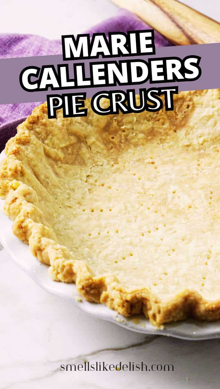 Baked pie crust with crimped edge in a white dish labeled
