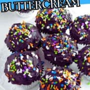 Chocolate cupcakes with black buttercream and colorful sprinkles sit on a white platter. Text overlay: “Natural Black Buttercream.”.