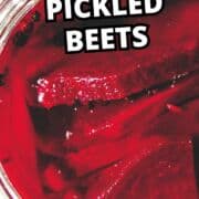 A jar of red pickled beet slices with “Old Fashioned Pickled Beets” in bold text and a faint website name at the bottom.