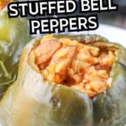 Close-up of a green bell pepper filled with rice and sausage, with “Old Fashioned Stuffed Bell Peppers” text above.