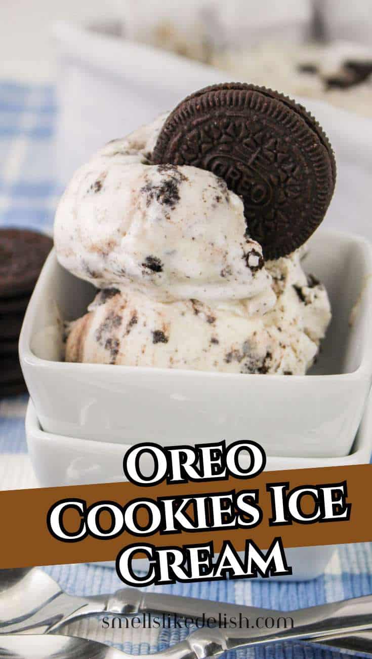 Cookies and cream ice cream with Oreo pieces and a whole Oreo on top in a white dish, next to spoons and a blue checkered cloth. Text: