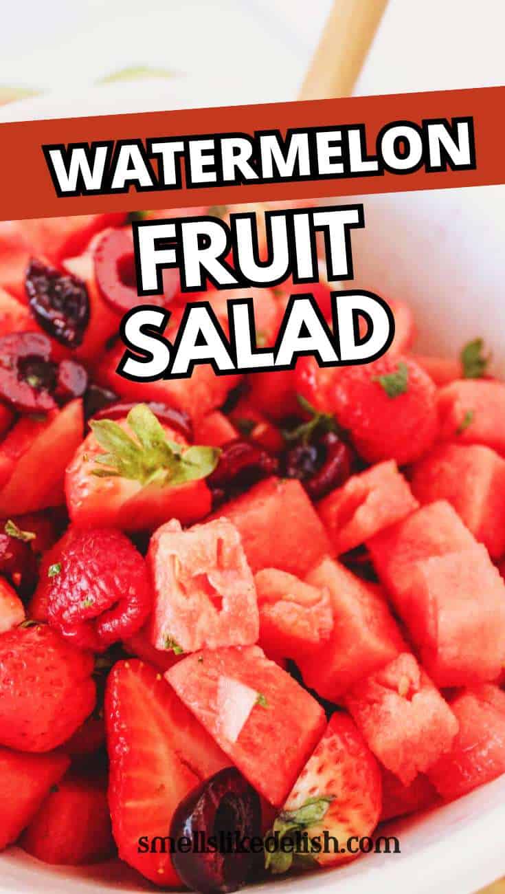 Close-up of watermelon fruit salad with strawberries and cherries in a white bowl, with bold