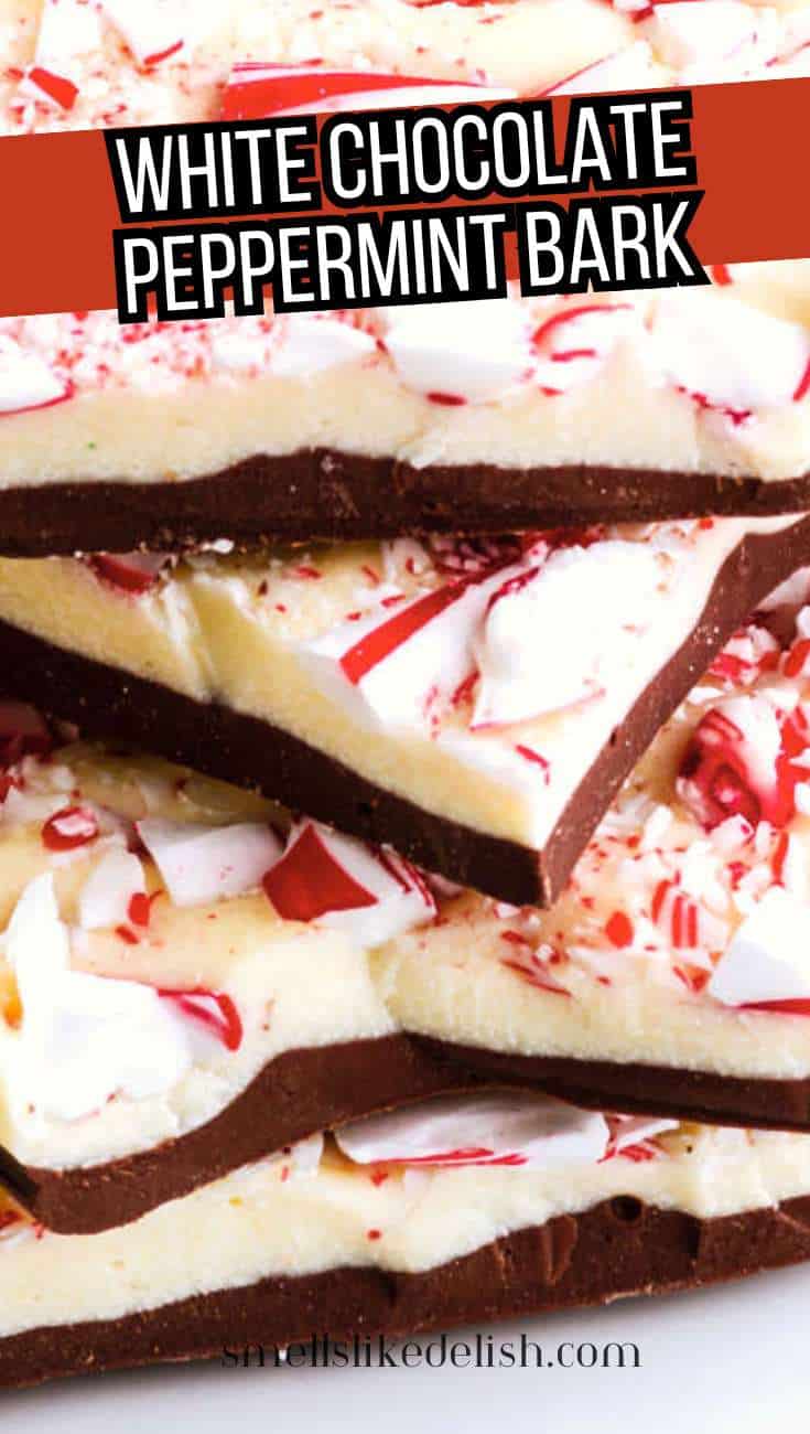 Stacked white chocolate peppermint bark with crushed peppermint on top, dark chocolate layer beneath, and a bold